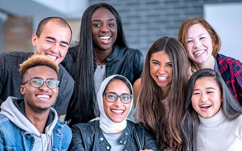 Multicultural Affairs A group of people of different cultural backgrounds smiling