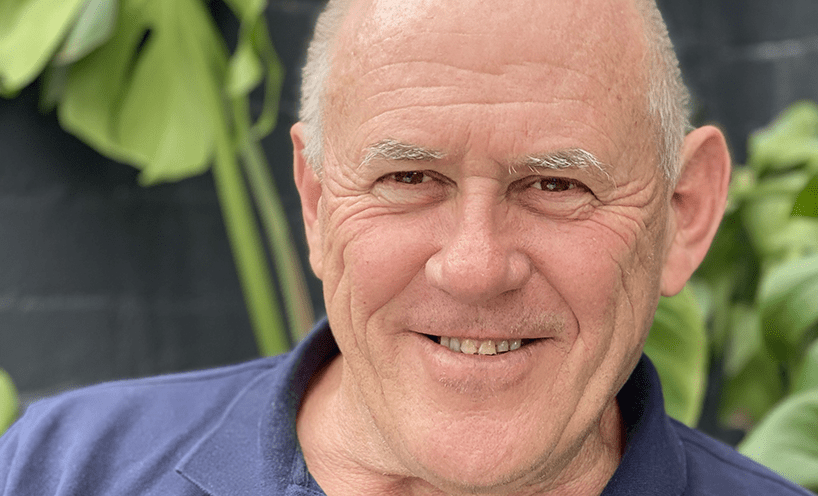 Stefan Romaniw OAM A close-up portrait of a man in a blue shirt